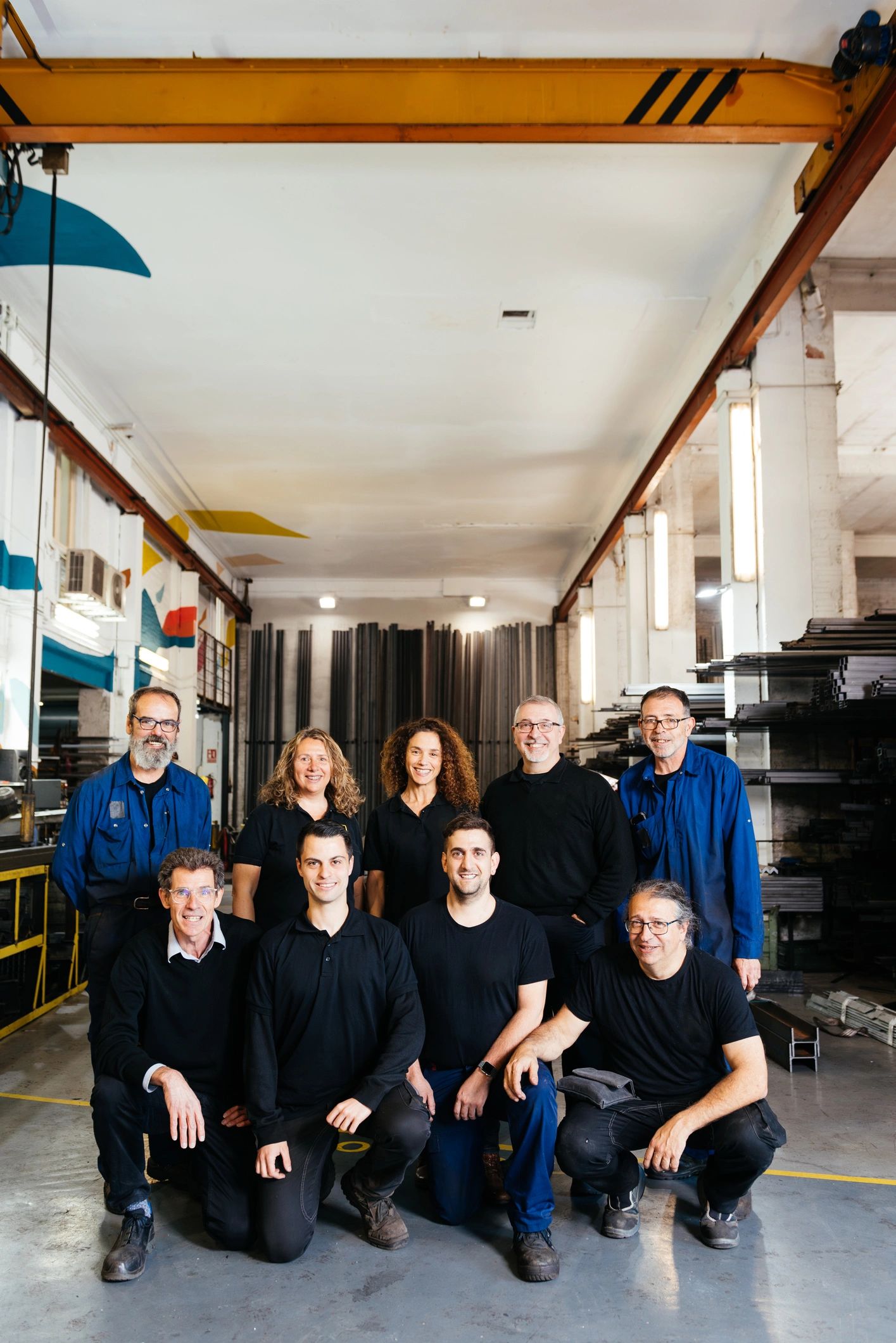 Workshop colleagues standing together in uniform